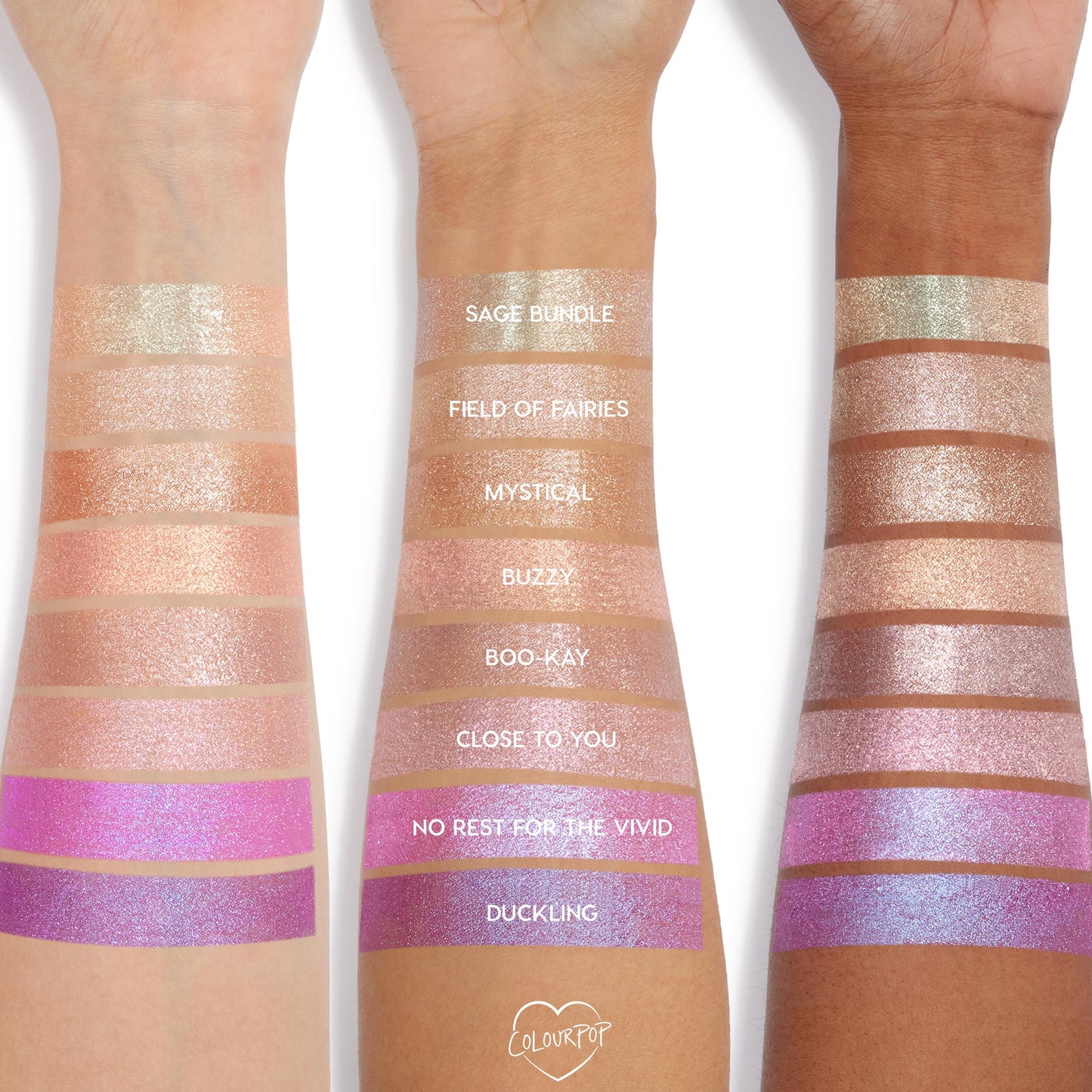 Buzzy Jelly Much Shadow swatched on three arms, showing a peachy rose-gold shimmer stripe among labeled shades; the ColourPop Jelly Much Shadow jelly-gel eyeshadow reflects metallic sparkle across light to deep skin tones.